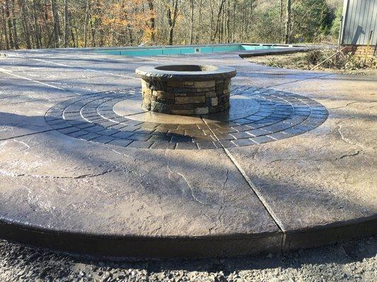 Custom stained fire pit w/ radial cobblestone stained surround