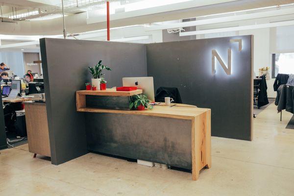 Custom reception desk made with oak and steel.