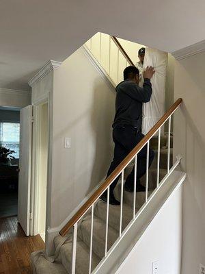 Taking the box spring up the stairs