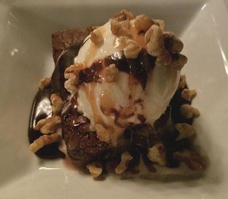 Chocolate covered brownie with salted caramel and walnuts