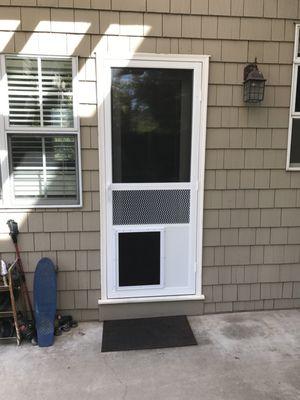 Single screen door with pet door.