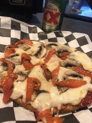 Appetizer pizza with mushrooms and roasted red peppers