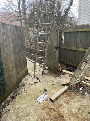 My back patio during the 2nd, unannounced day of gutter repairs.