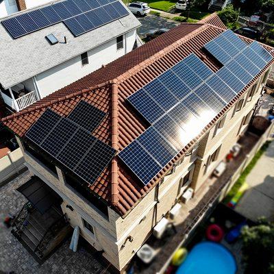 Solar equipment installed on a pitched clay roof.