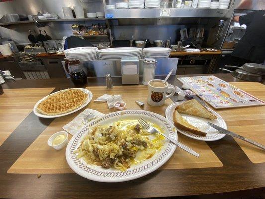 The big breakfast. Note how the waffles are no thicker than pancakes but taste great. Sausages were tiny.