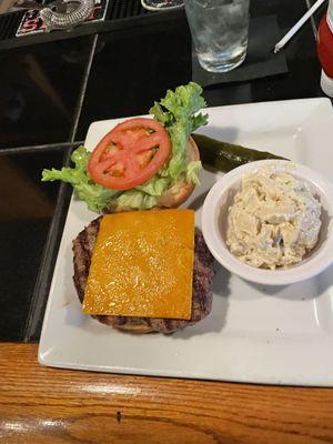 Cheddar Cheeseburger with a side of potato salad. The BEST tasting Burger ever! Potato salad delish too.