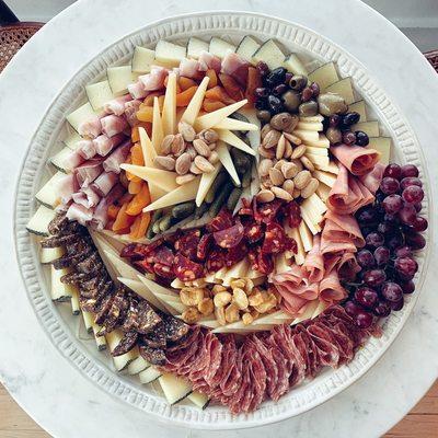 Extra large cheese and meat platter on a customer-supplied platter. Pricing on custom platters based on size.