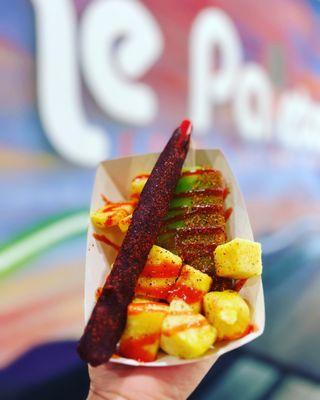 Lime paleta with tajin,  chamoy and pineapple