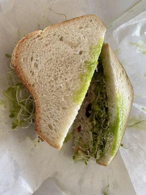 Sliced sourdough, garlic spread, lettuce, sprouts, chicken salad