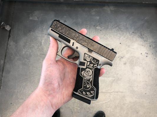 Glock 43x with laser etched slide, laser stippling, hand stippling and framework.