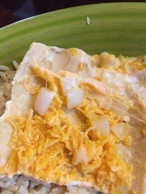 Raw onion and cold cheese shred enchiladas