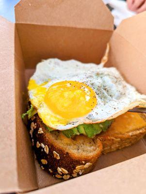 Joleen: open face egg sando with avocado and melted Tillamook cheddar