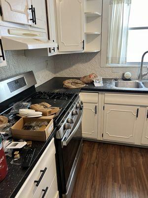 The contractor left the kitchen, a mess sawdust throughout the kitchen and trash.