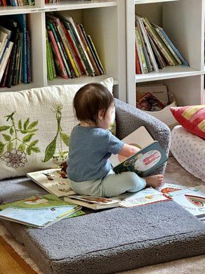 This little 1 year old loving her books!!