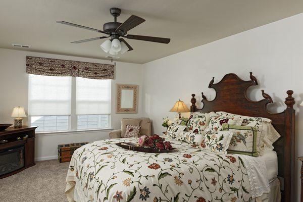 A crewel fabric valance and decorative pillow are the best partners for a client's crewel bedding.