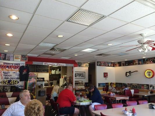 Corner booth, breakfast specials above the kitchen.