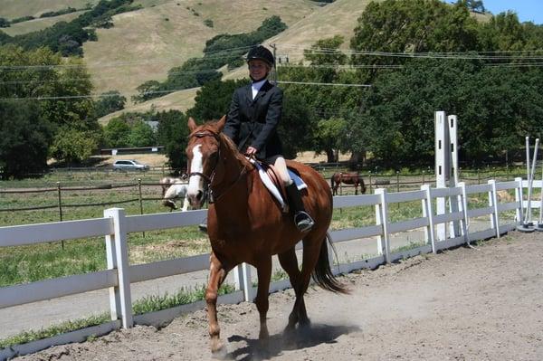 A student participating in a horse show.