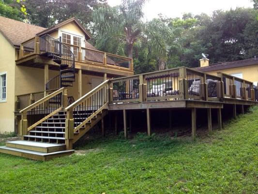 Adding a matching deck and balcony can transform any backyard.