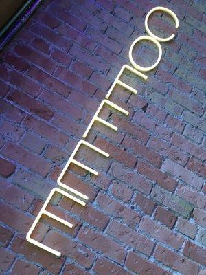 Neon signs with lots of outdoor lighting.