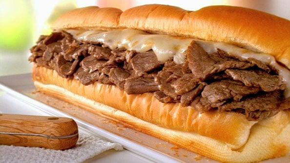 Foot Long (+) Cheese Steaks made with  1/2 lb. Of Prime shaved Ribeye on a toasted French roll from a local "mom & pop" bakery.