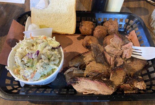 Brisket plate with hush puppies and slaw.