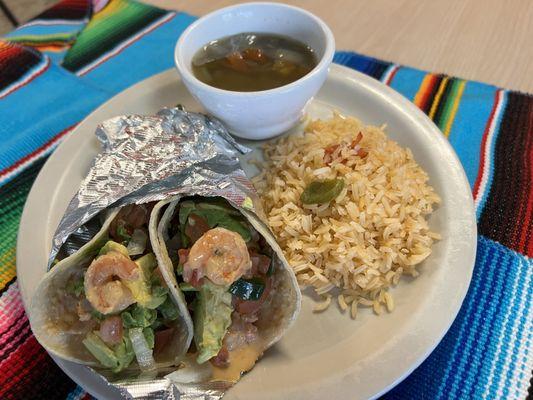 Shrimp tacos with crema de chipotle with pico de gallo and slice avocado. Served with a side of Spanish rice and a side of lentejas.