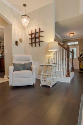 Wide dark stained oak wood floors.