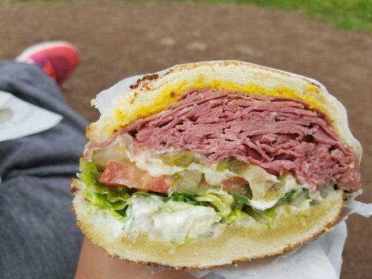 Corned beef sandwich with garlic parmesan sauce and sharp white cheddar