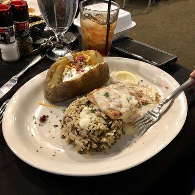 Salmon Filet with buttery sauce, baked potato & wild rice