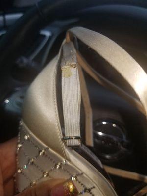 This was my wedding shoe that he destroyed. Look at the strap with the dirty elastic that doesn't match the strap