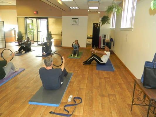 Pilates mat class with magic circle prop