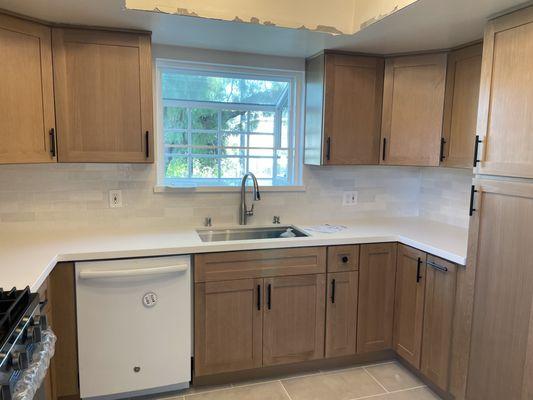 Oak shaker kitchen cabinets, pure white quartz and cloe tile back splash