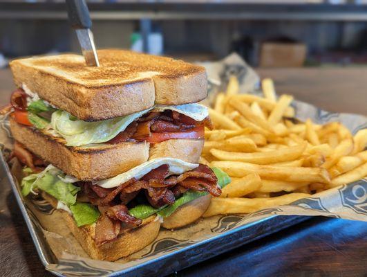 This Belt Buster sandwich is sure to please with 1 pound of bacon, lettuce tomato and mayo! Served with fries