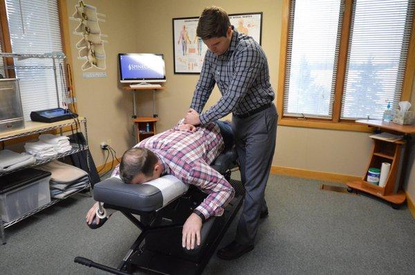 Dr. Rowe giving chiropractic care