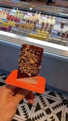 Coco Paleta dipped in chocolate and nuts!