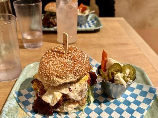 Mexican street burger with fried egg, smash patty, avocado, American cheese, ham and lettuce on sesame bun - absolutely delicious!!!