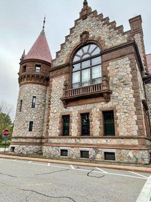 The beautiful historic 1880's stone structure in a Richardsonian Romanesque Architectural Style is a Castle/City Hall @ Hunnewell Park.