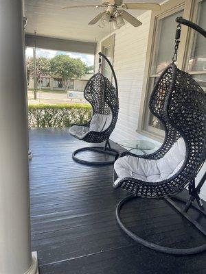 Cozy chairs on front porch.