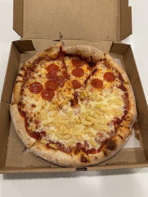 Half pepperoni, half pineapple pizza