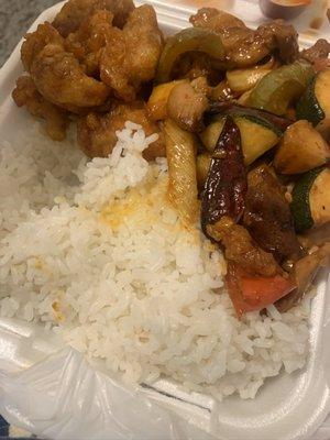 Steamed rice, orange chicken, and kung pao chicken.