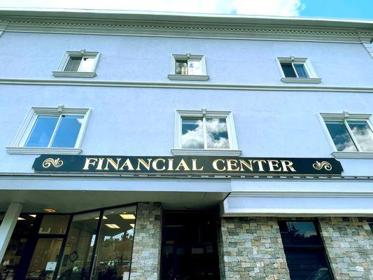 The "FINANCIAL CENTER" sign for Affiliated Financial Group on Albion Street in Wakefield, MA.