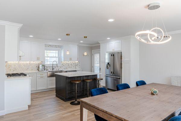 Dark walnut island cabinets with country bar stools