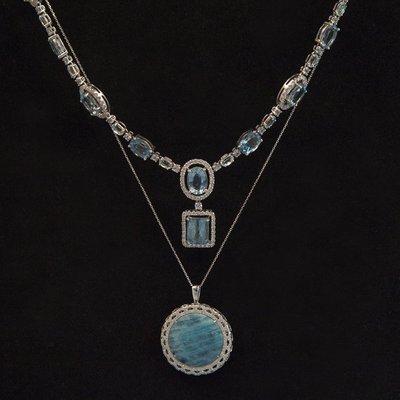 2 aquamarine necklaces.