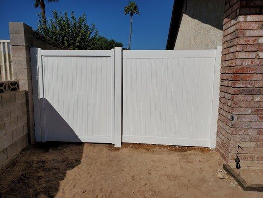 Stationary fence with left-swinging gate