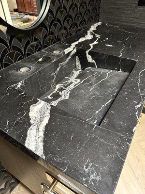 Custom black marble sink with etching (the cloudy part) before work was done