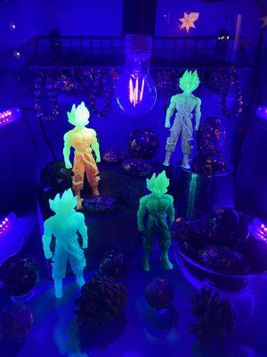 Yooperlite stone glows under UV light. Goku glow in the dark made from resin.