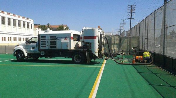 Vacuum excavation of a storm drain culvert in Oakland.