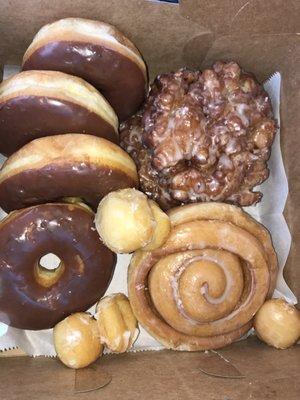 Chocolate donuts, apple fritters, cinnamon roll