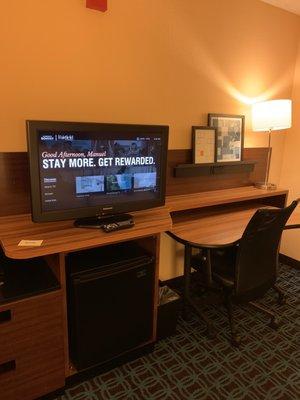 TV, mini fridge and desk