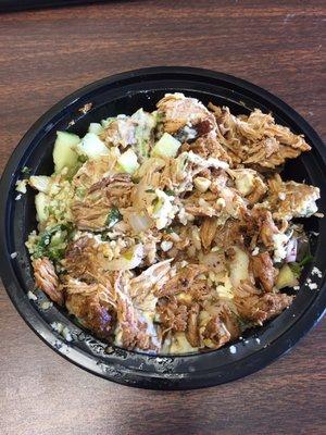 Pork bowl with cucumbers, onions, feta, tabouli, and tzatziki.